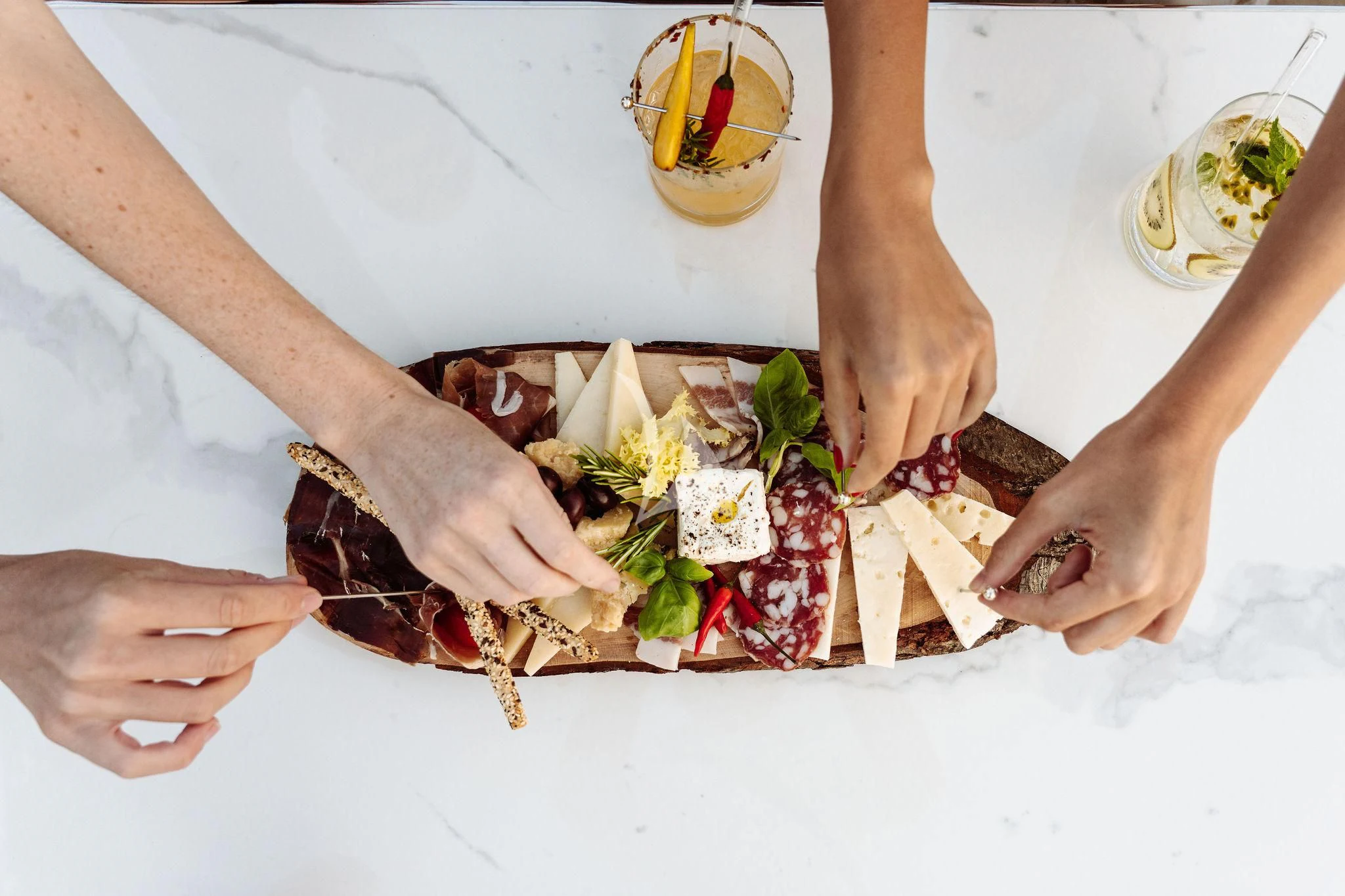 a person cutting a piece of food aboard SAMIRA Yacht for Sale