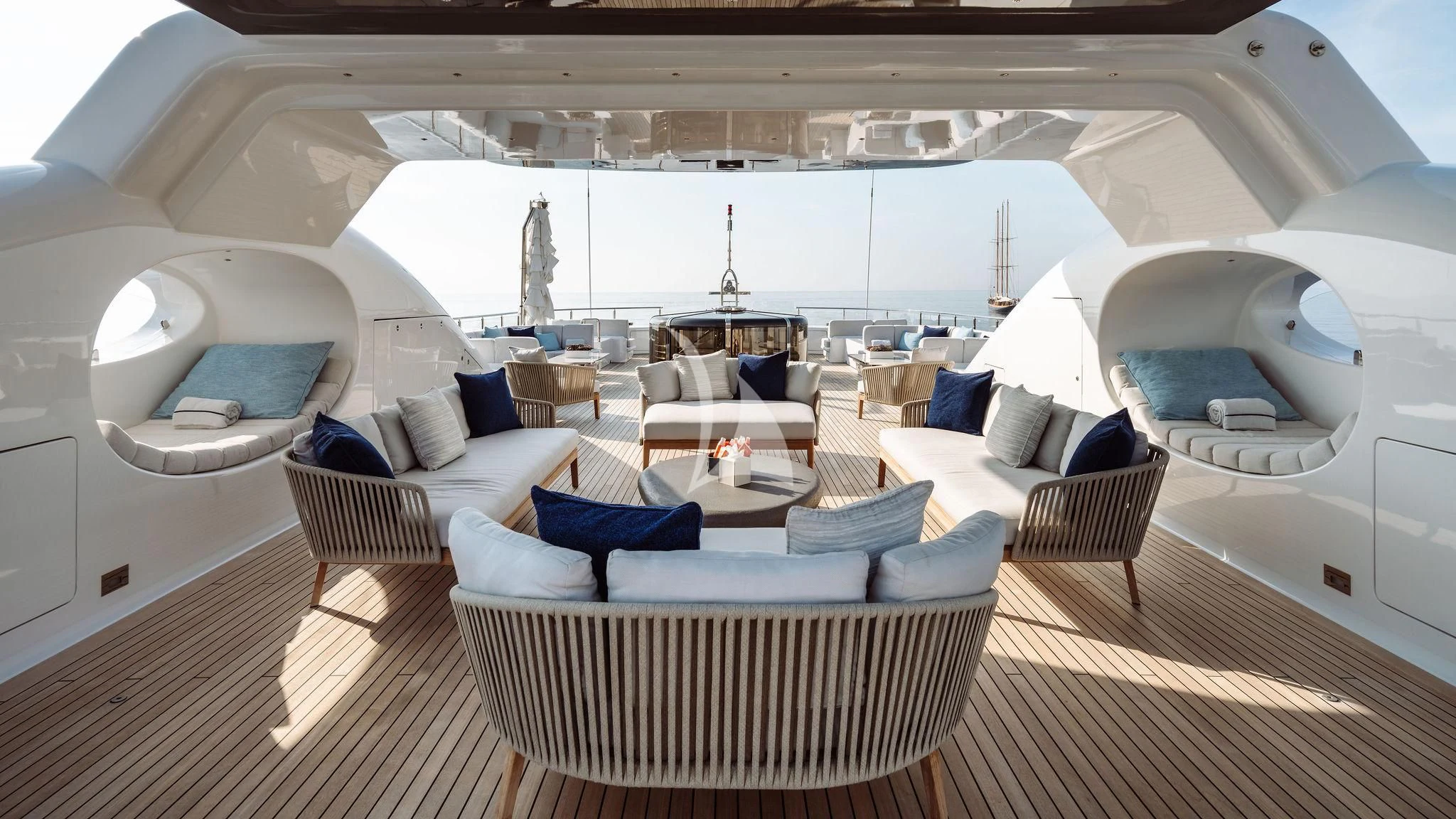 a large room with a couch and a table aboard SAMIRA Yacht for Sale