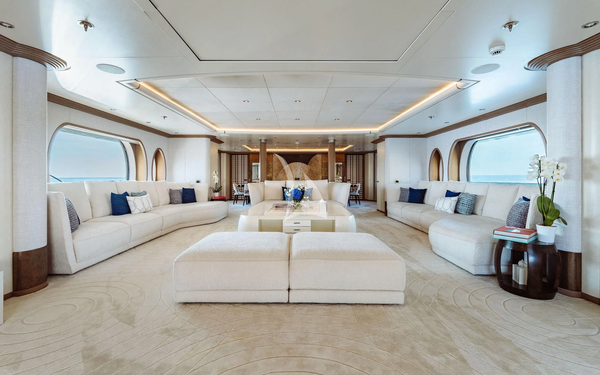 a living room with a couch and a table aboard SAMIRA Yacht for Sale