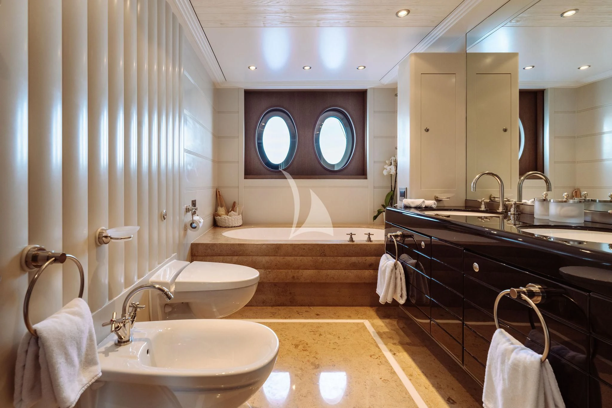 a bathroom with a large mirror aboard SAMIRA Yacht for Sale
