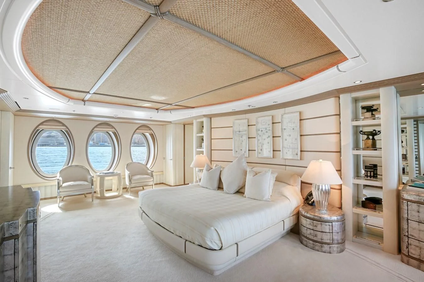 a large white room with a large white bed and a large white shelf aboard SAMIRA Yacht for Sale