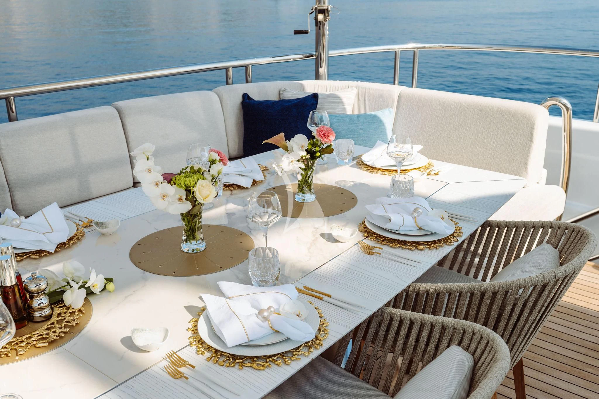 a table set for a dinner aboard SAMIRA Yacht for Sale