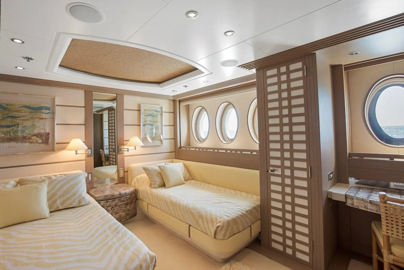 a room with a bed and a wood door aboard SAMIRA Yacht for Sale