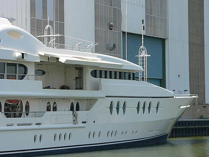 a white boat in a building aboard SAMIRA Yacht for Sale