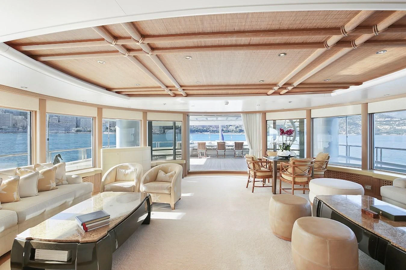 a large living room with a large window aboard SAMIRA Yacht for Sale
