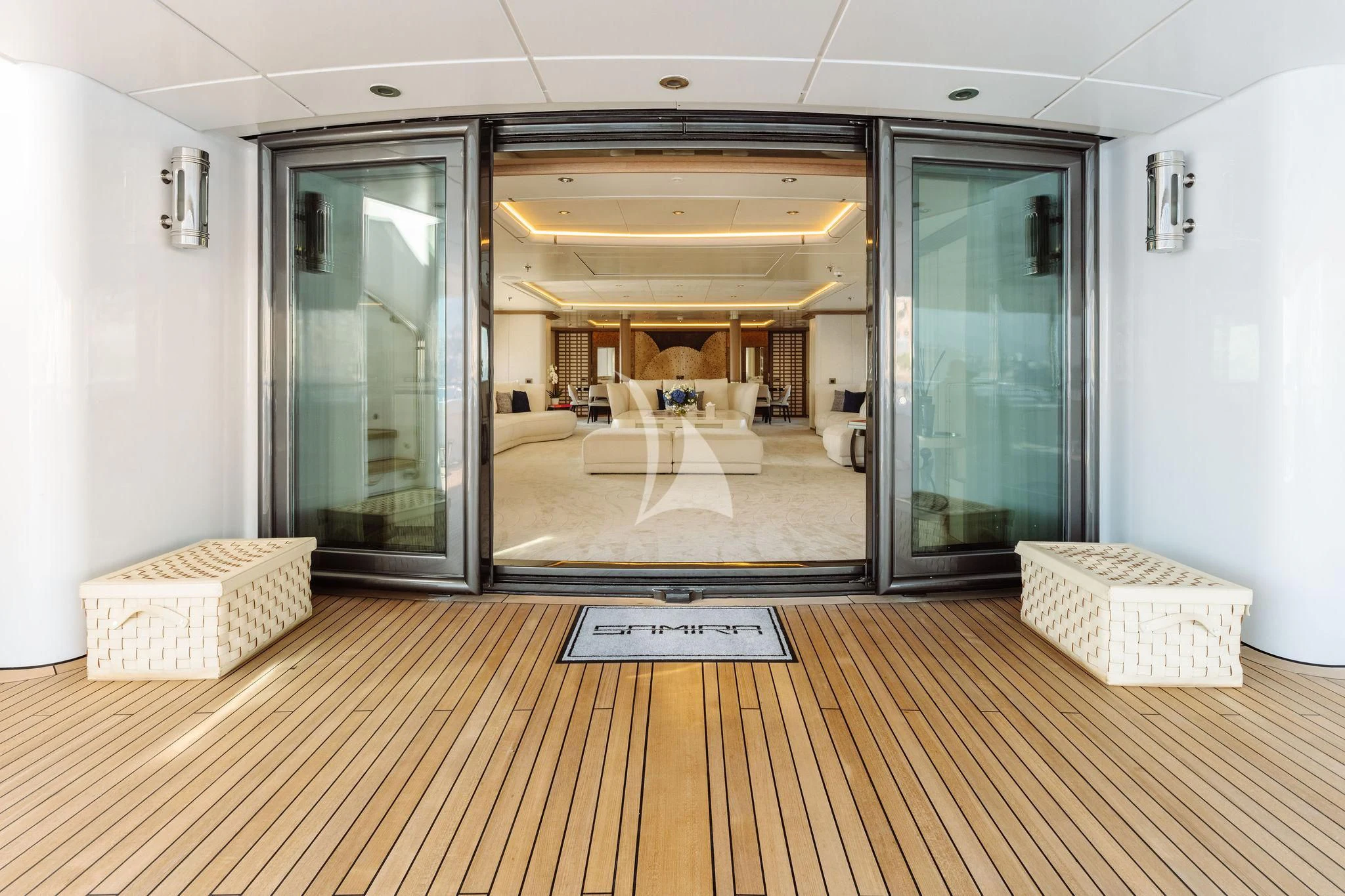 a room with a wood floor and a glass door aboard SAMIRA Yacht for Sale