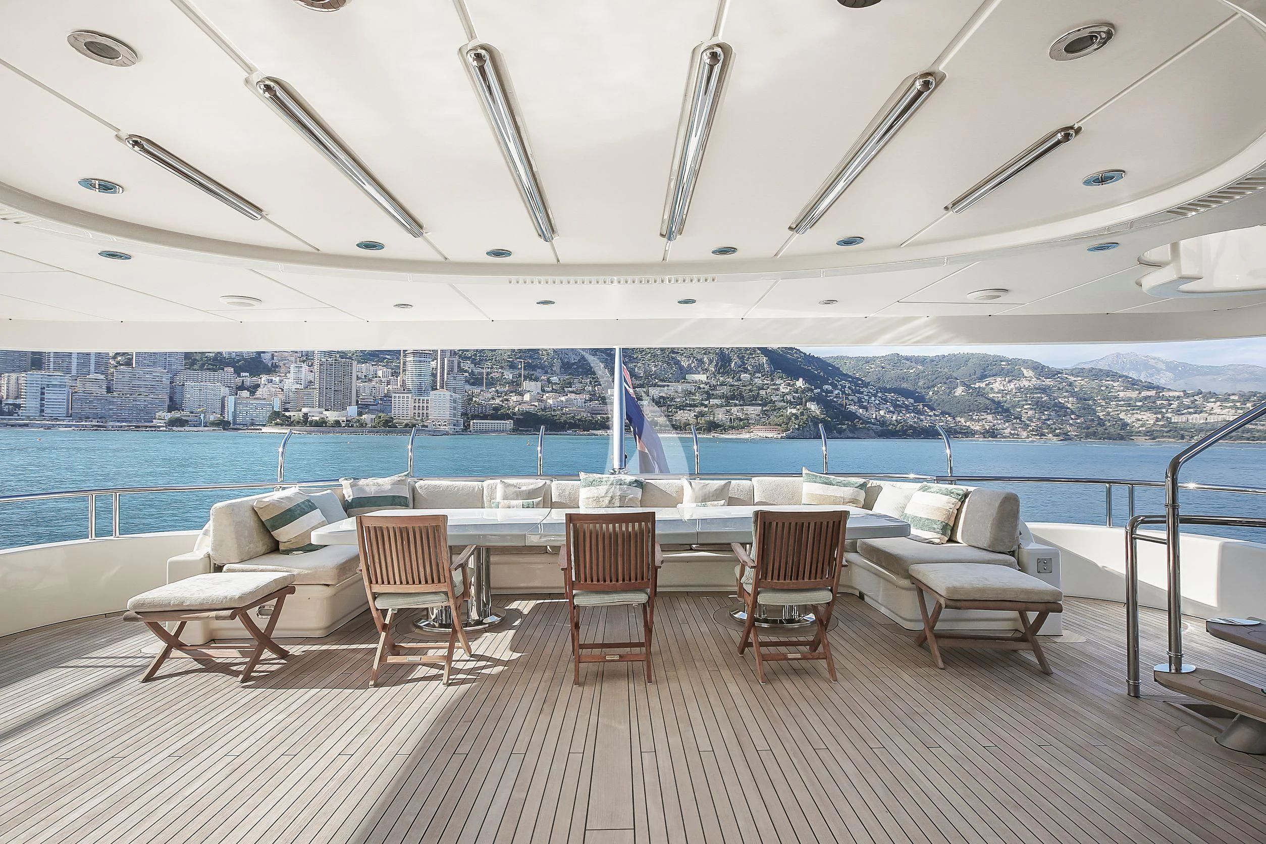a room with chairs and a pool aboard SAMIRA Yacht for Sale