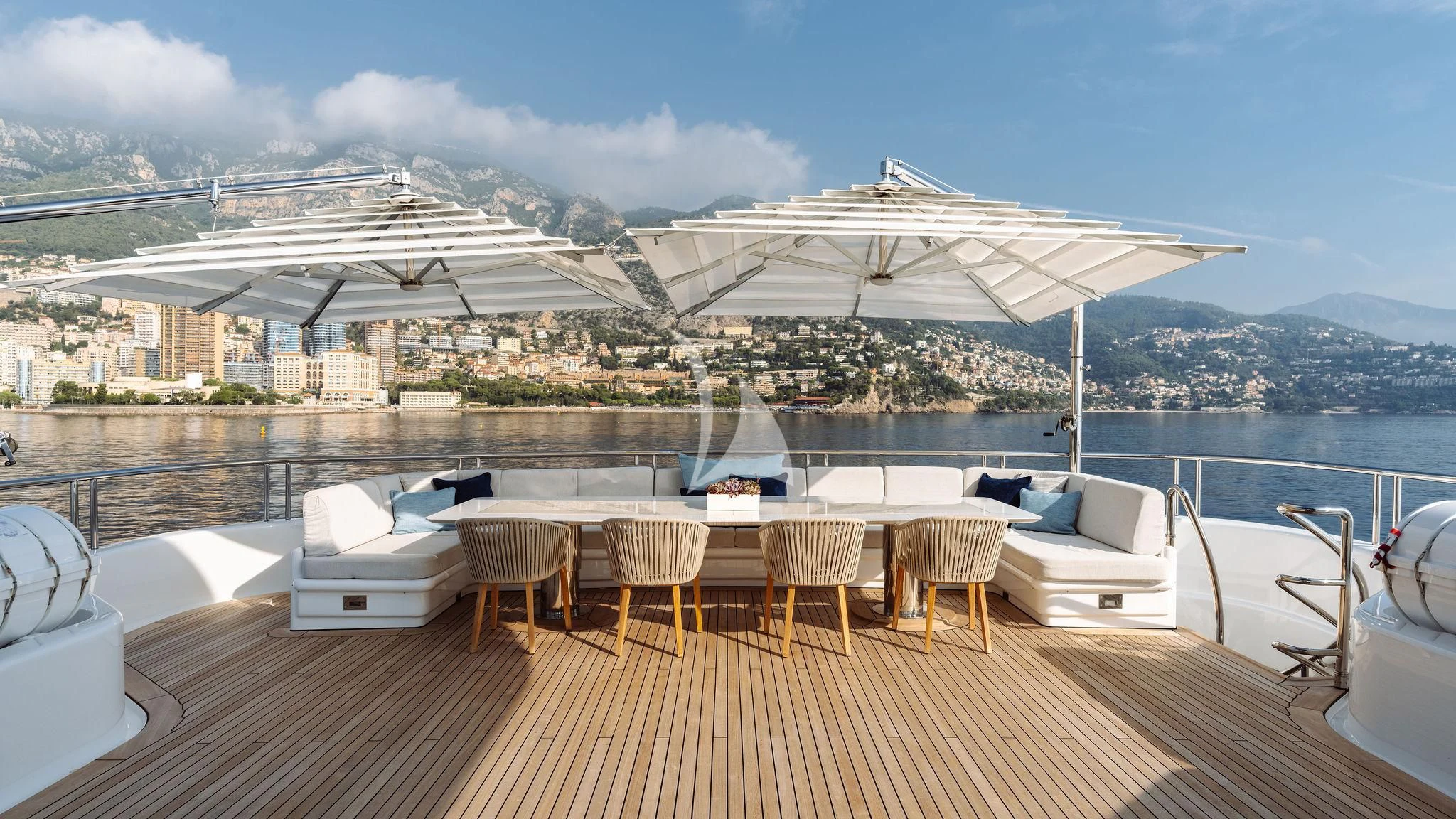 a deck with lounge chairs and a large white building with a large white dome on top of it aboard SAMIRA Yacht for Sale
