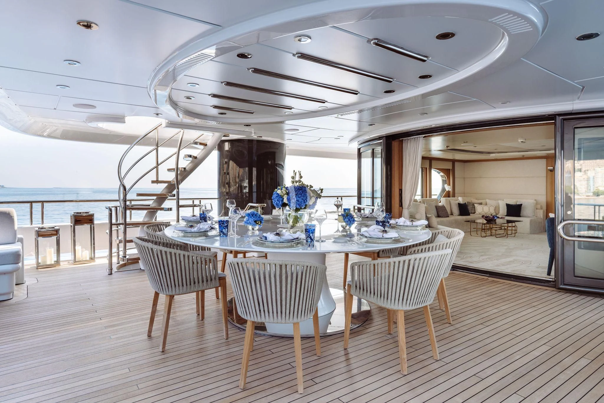 a large room with tables and chairs aboard SAMIRA Yacht for Sale