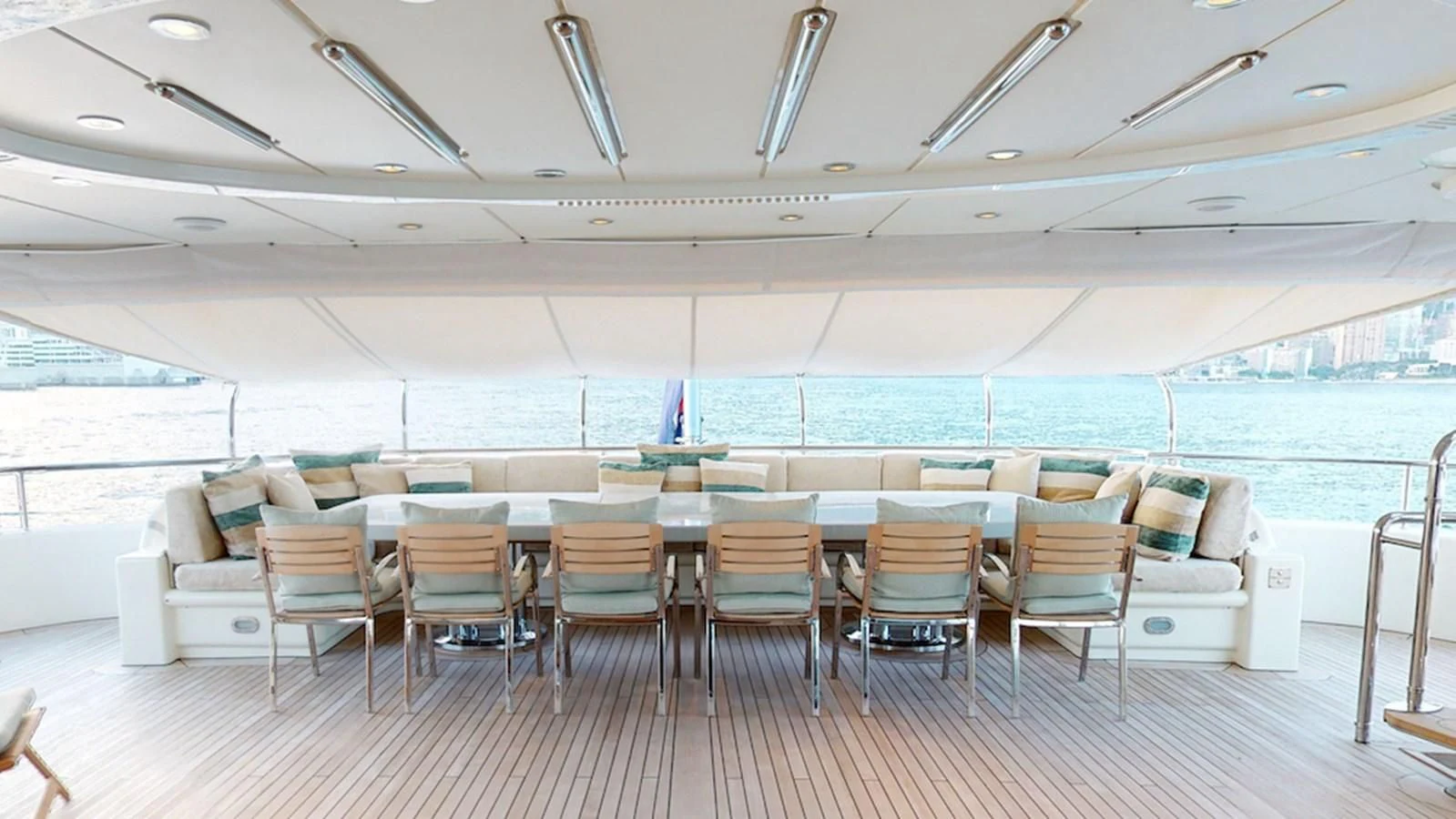 a room with chairs and a pool aboard SAMIRA Yacht for Sale