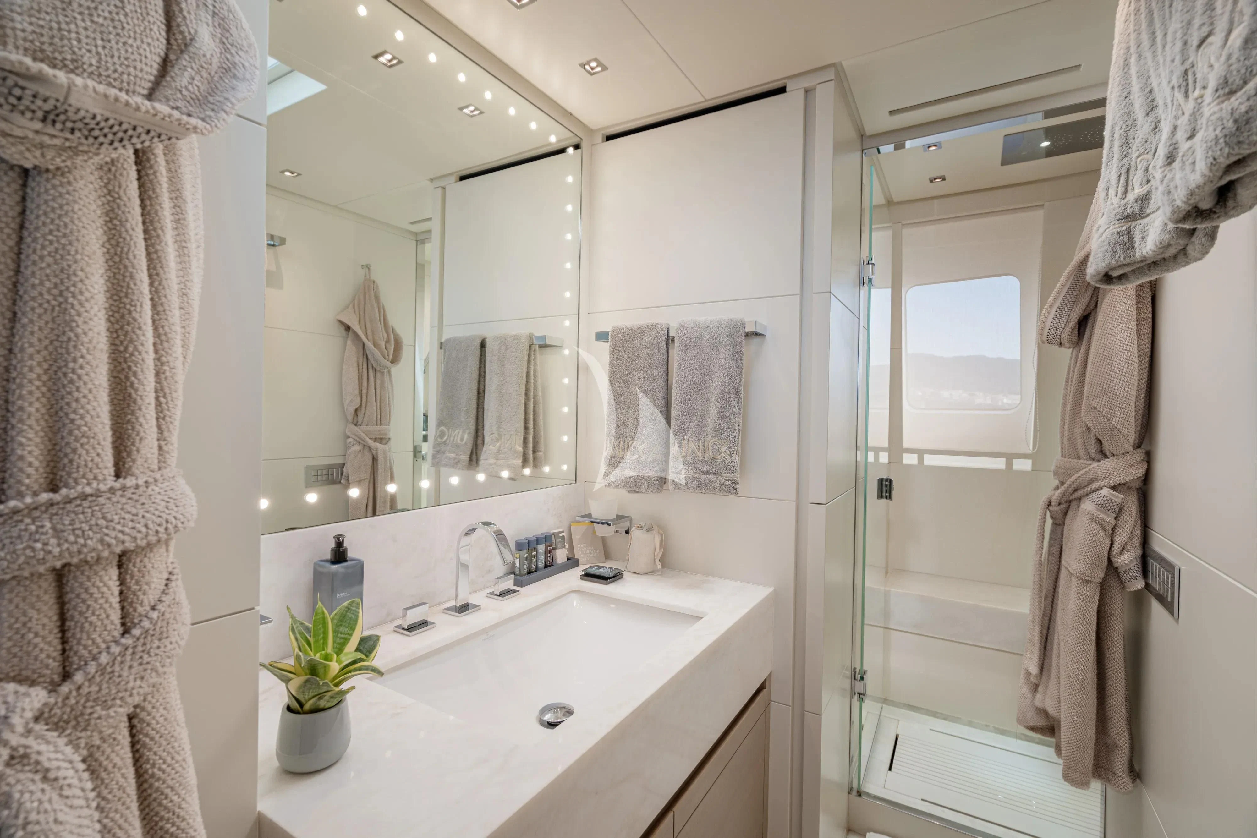 a bathroom with a sink and a shower aboard UNICKA Yacht for Sale