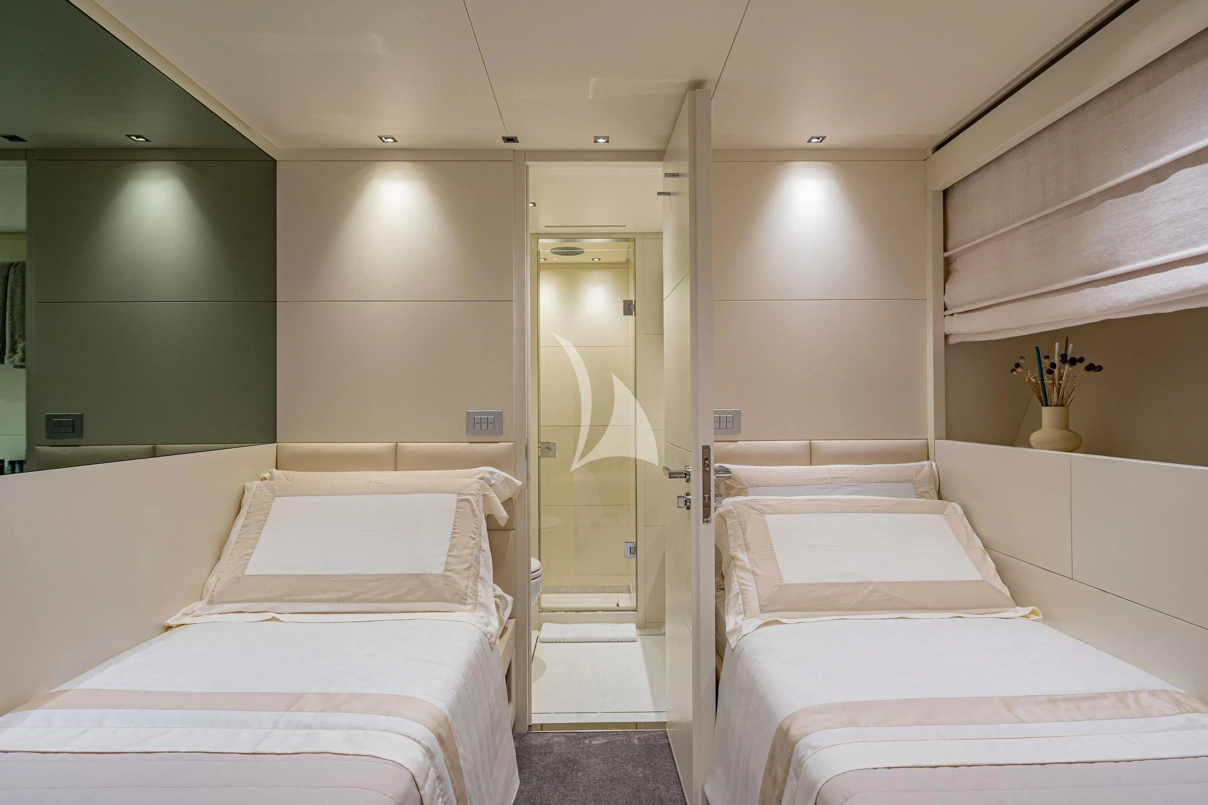 a room with two beds aboard UNICKA Yacht for Sale