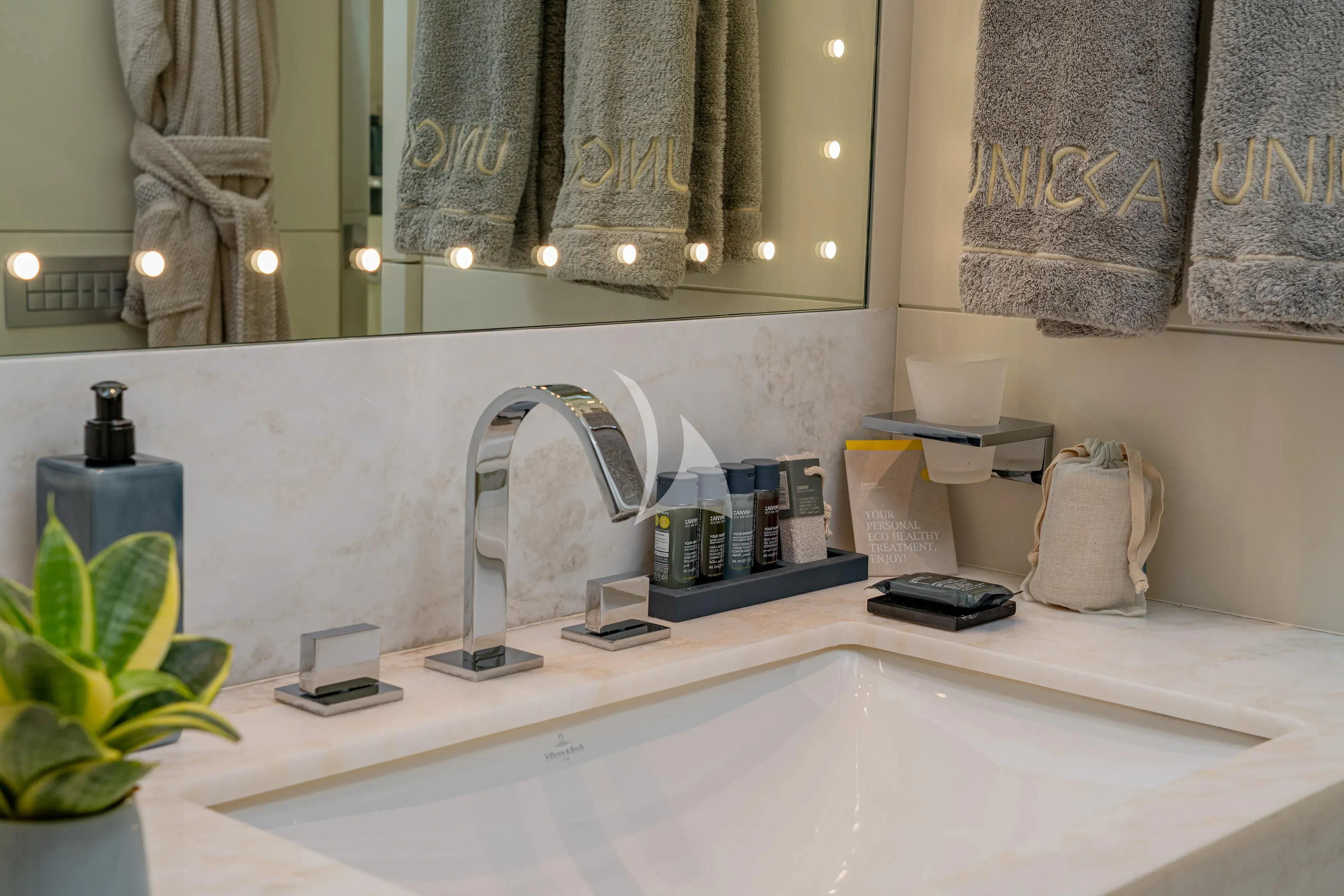 a bathroom with a large mirror aboard UNICKA Yacht for Sale