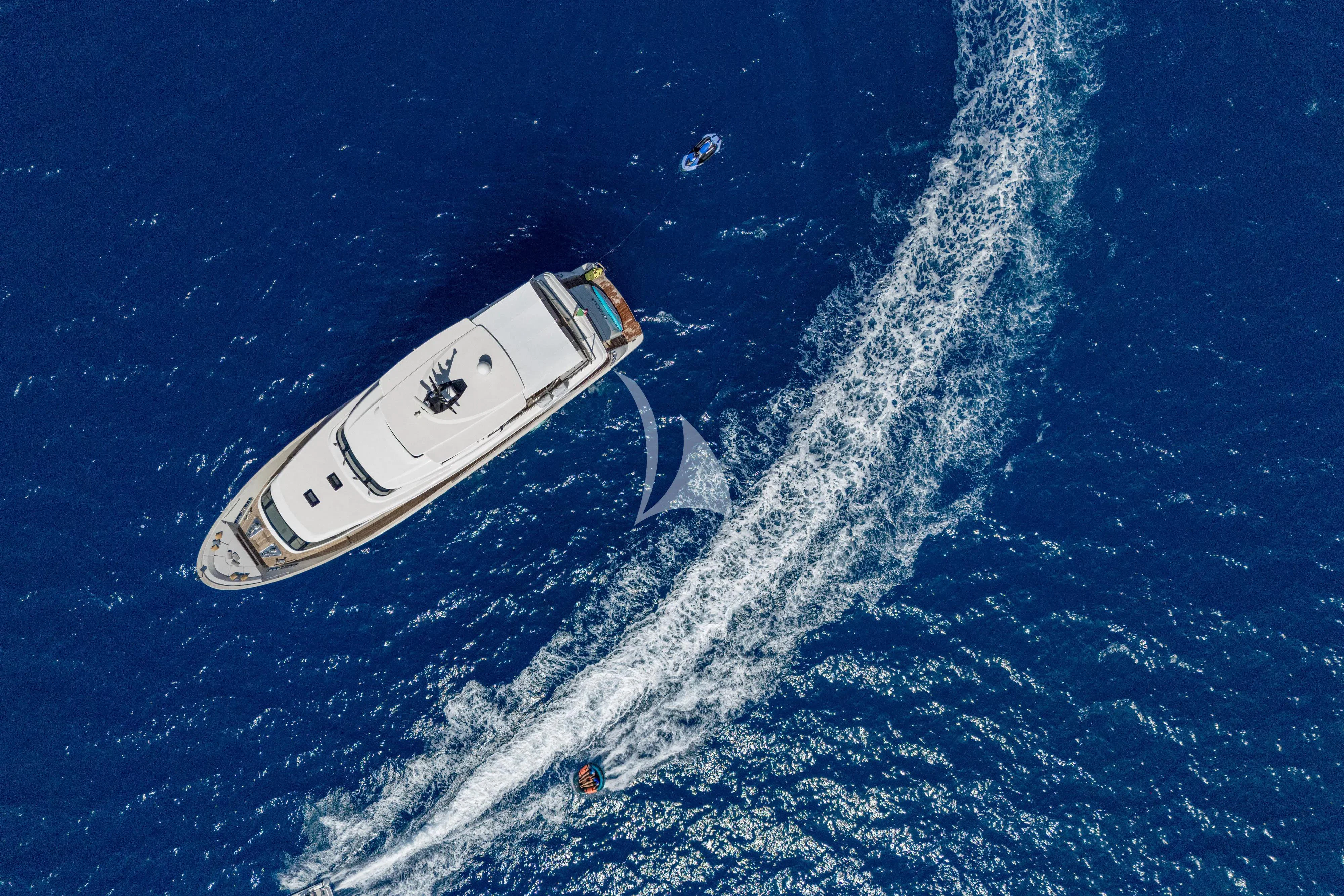 a white boat in the water aboard UNICKA Yacht for Sale
