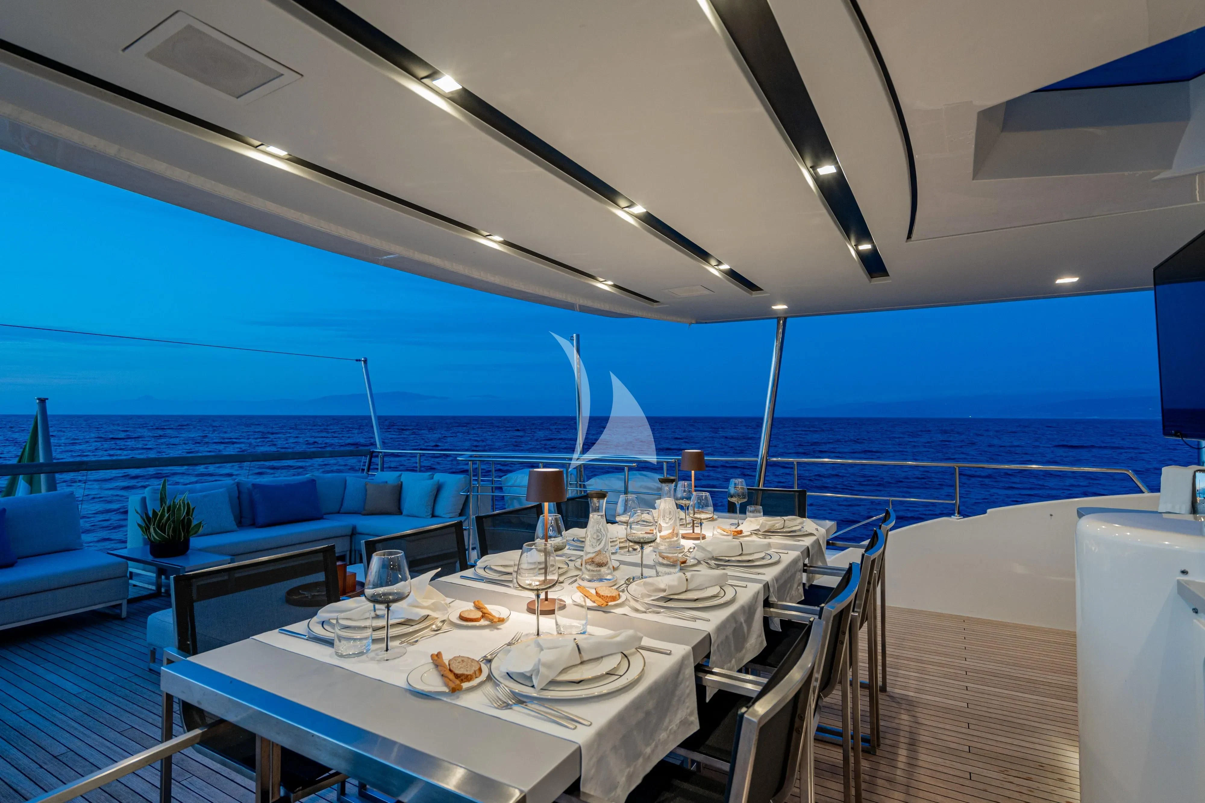 a table set for a dinner aboard UNICKA Yacht for Sale