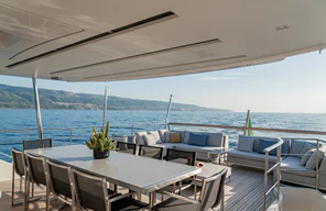 a table and chairs on a boat aboard UNICKA Yacht for Sale