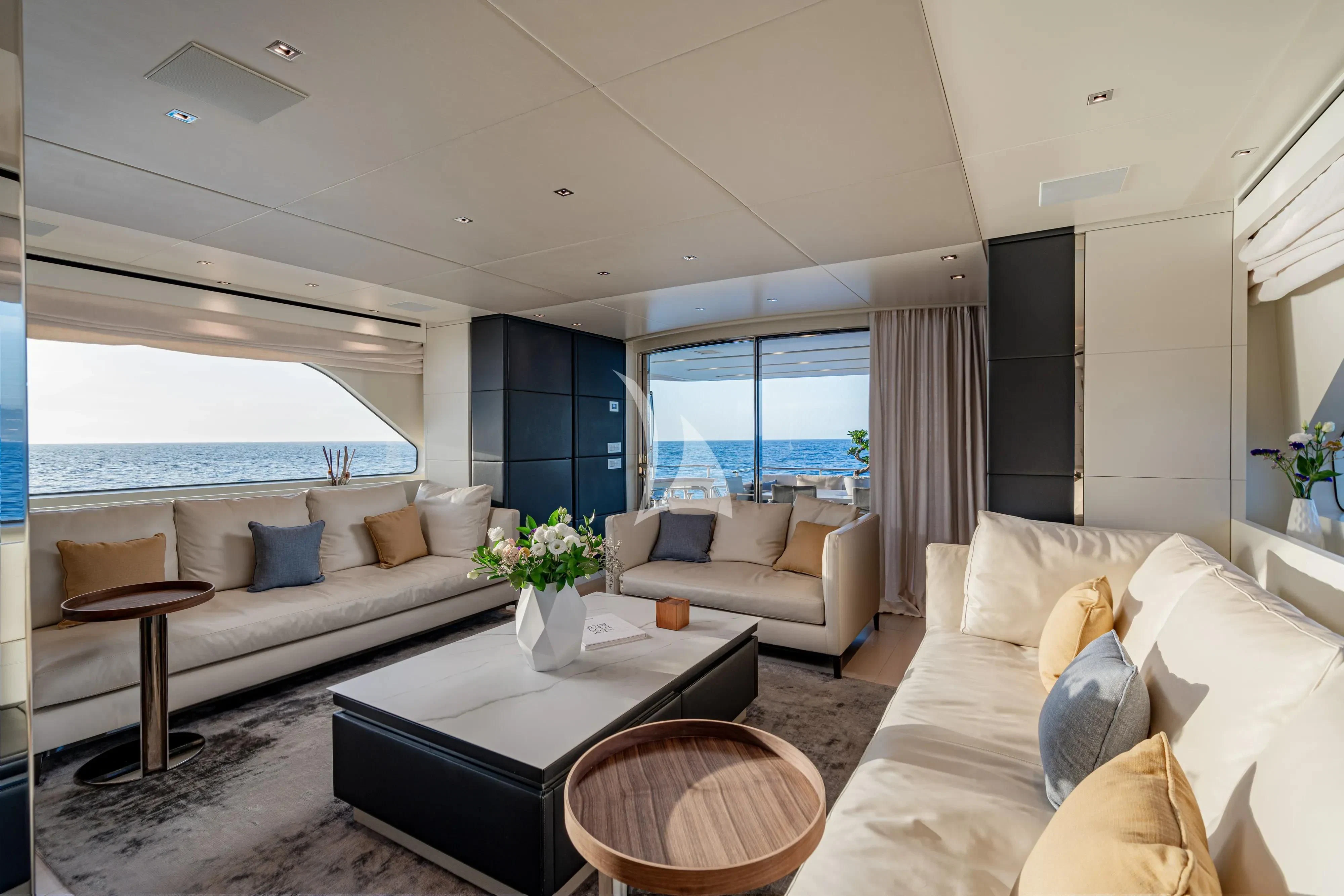a living room with a large window aboard UNICKA Yacht for Sale