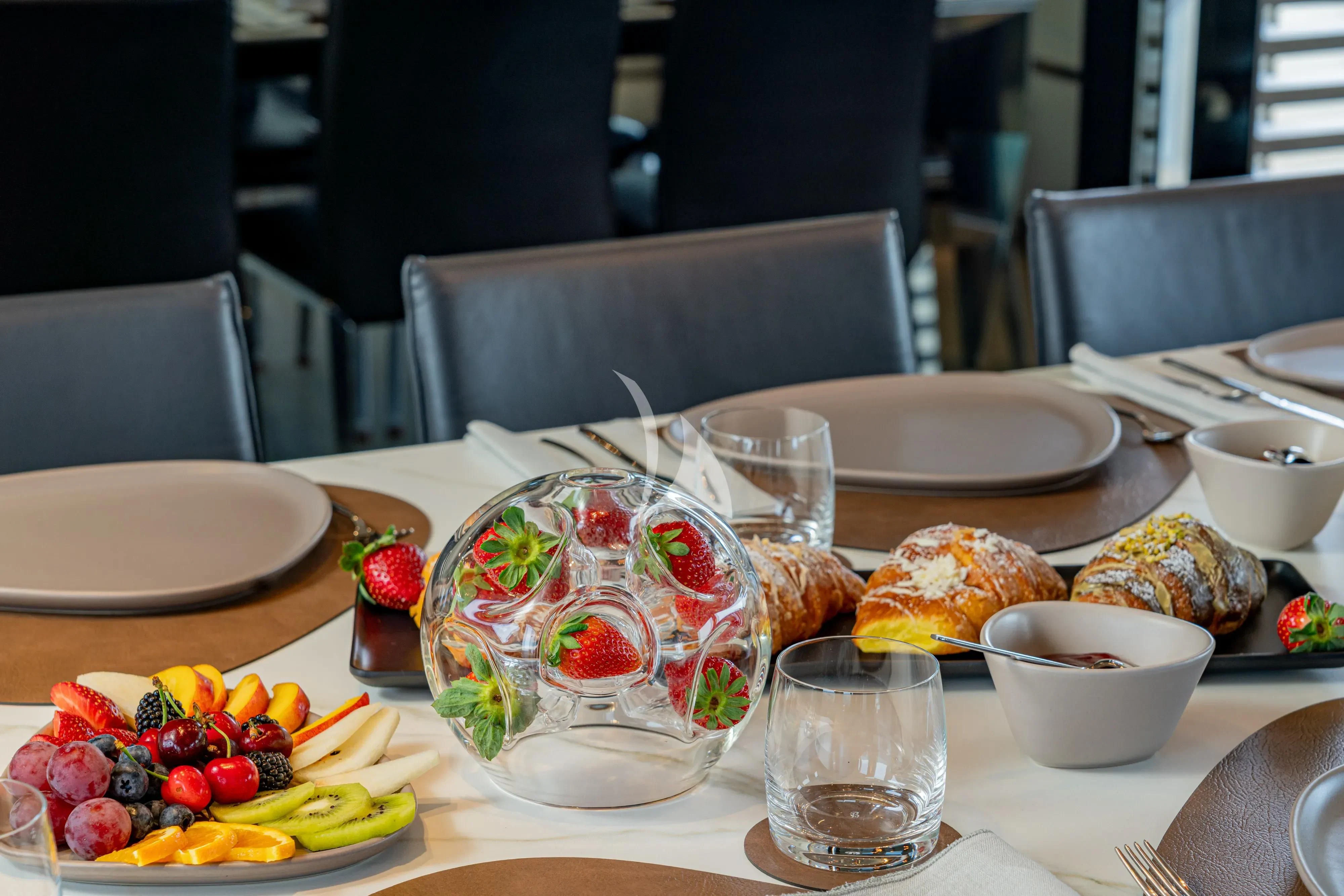 a table with food on it aboard UNICKA Yacht for Sale