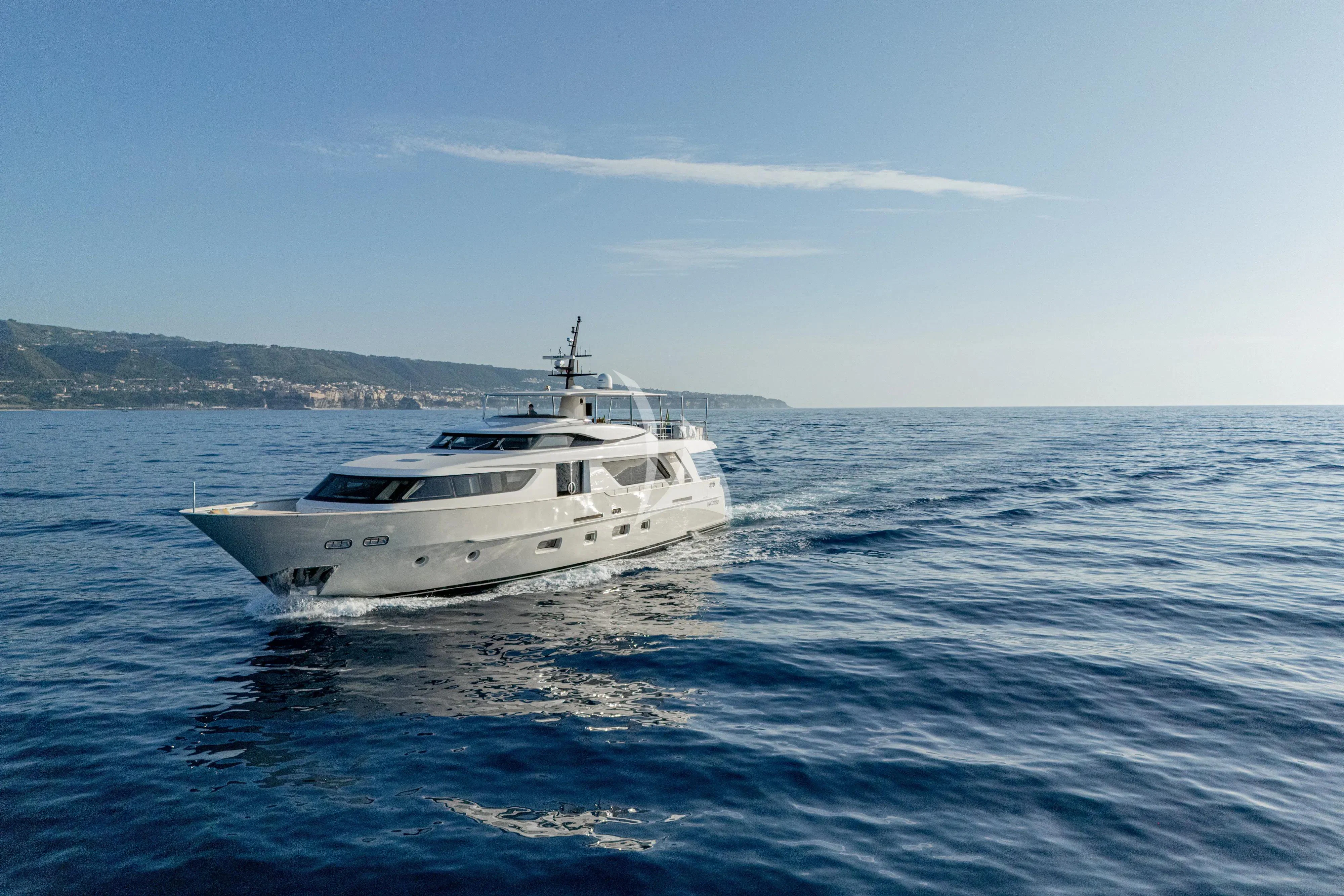 a white yacht in the water aboard UNICKA Yacht for Sale