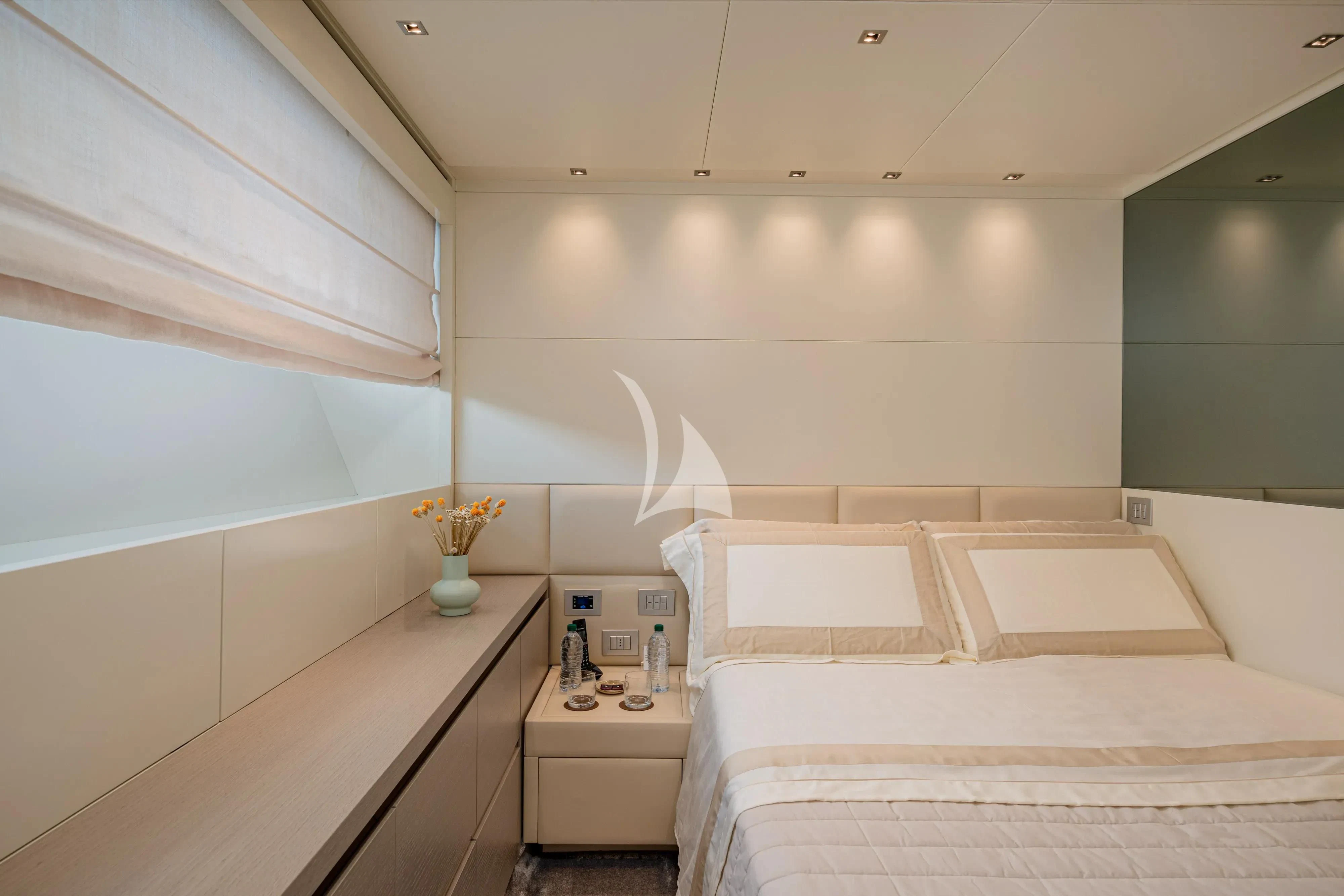 a room with a bed and a sink aboard UNICKA Yacht for Sale