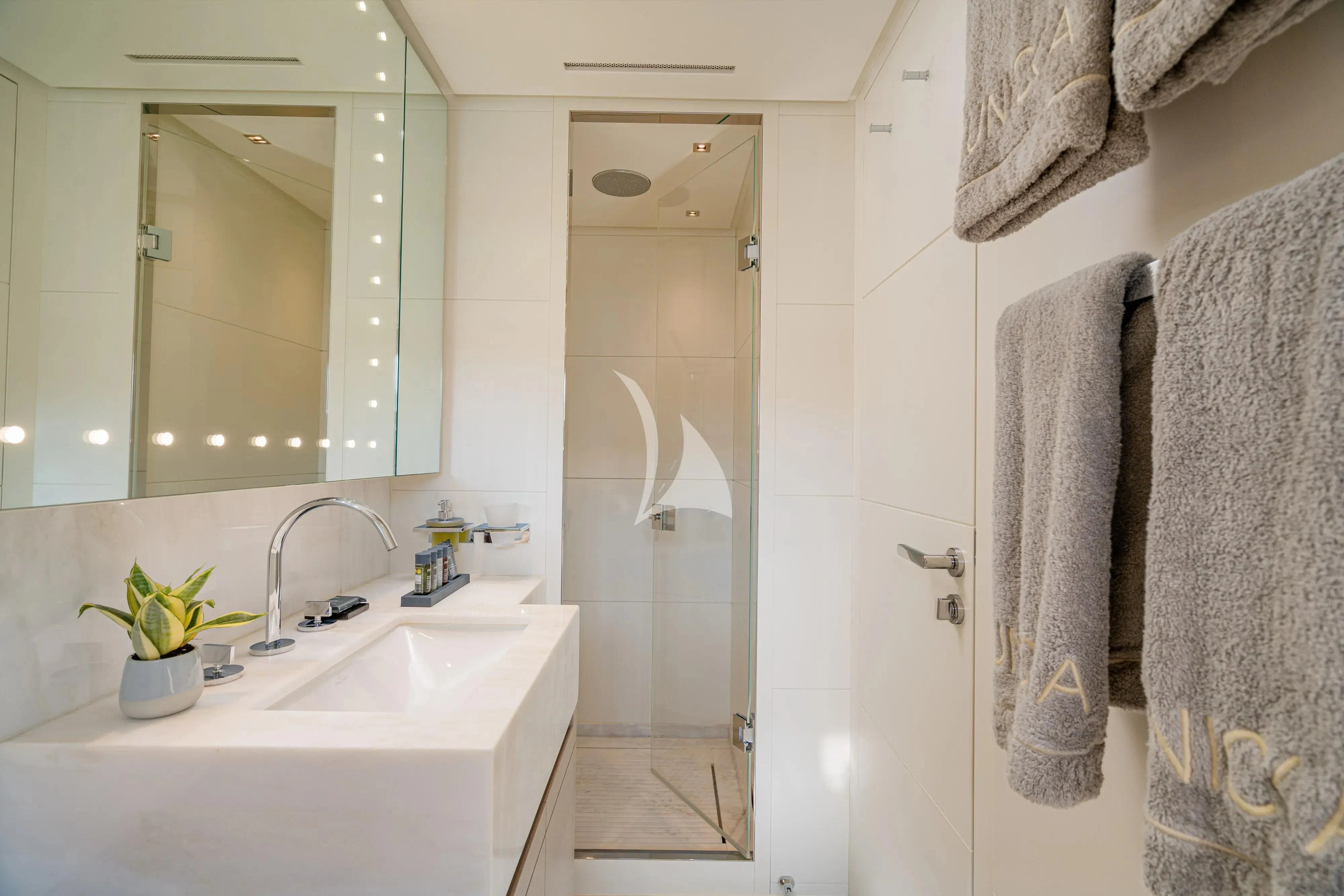 a bathroom with a sink and a shower aboard UNICKA Yacht for Sale