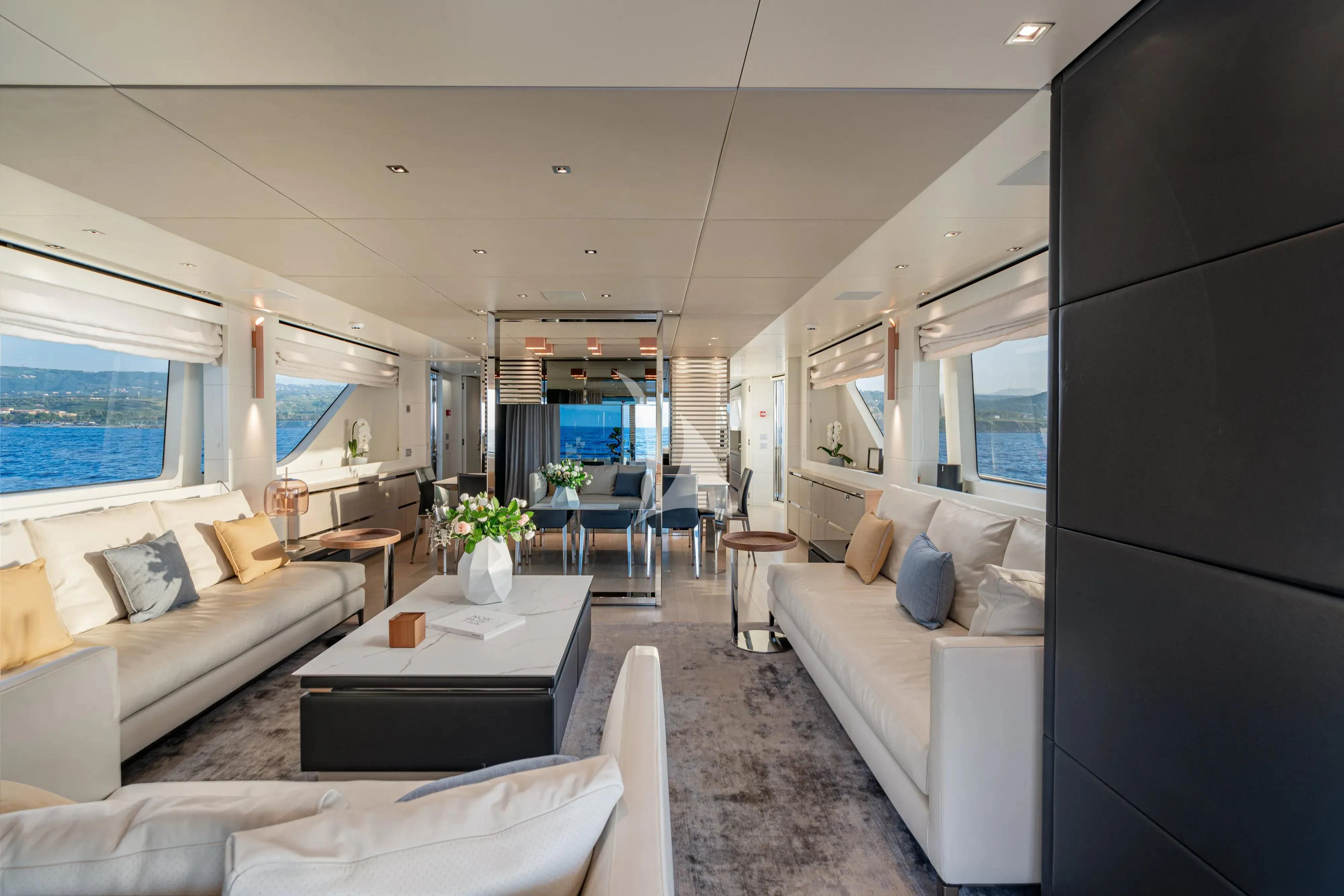 a living room with a couch and a table aboard UNICKA Yacht for Sale