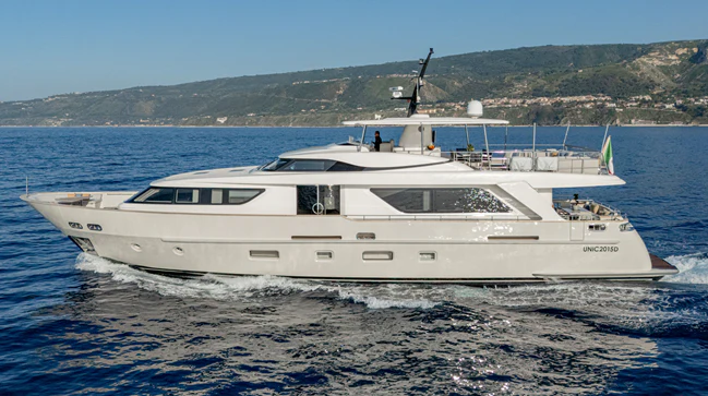 a white yacht in the water aboard UNICKA Yacht for Sale