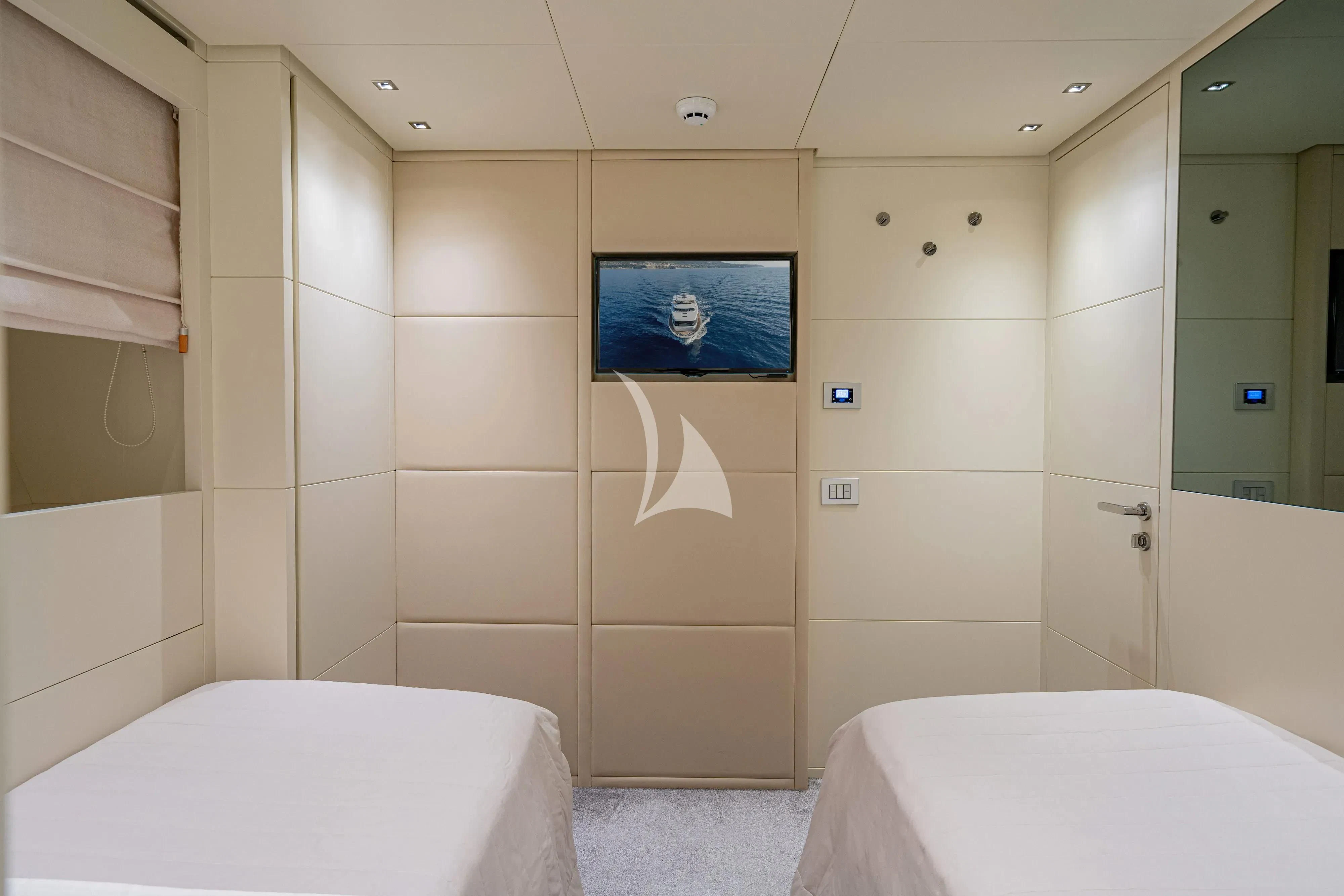 a bathroom with a bathtub and a mirror aboard UNICKA Yacht for Sale