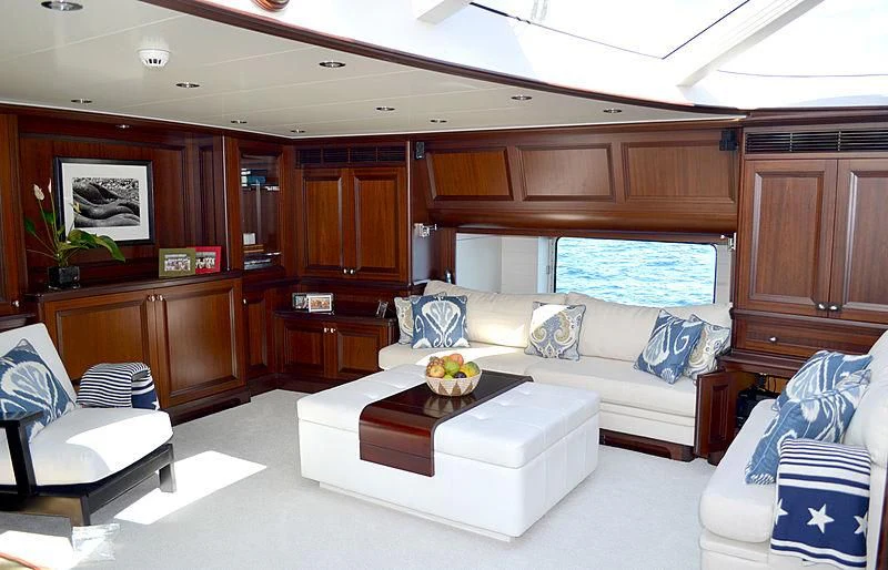 a living room with a couch and a table aboard LA BELLE Yacht for Sale