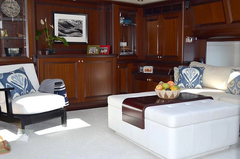 a living room with a couch and a coffee table aboard LA BELLE Yacht for Sale