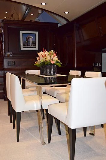 a room with a table and chairs aboard LA BELLE Yacht for Sale