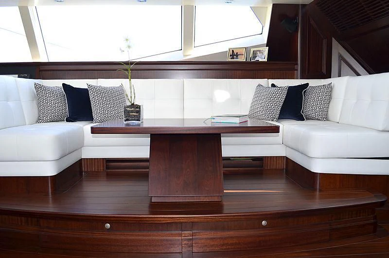 a living room with a couch and a coffee table aboard LA BELLE Yacht for Sale