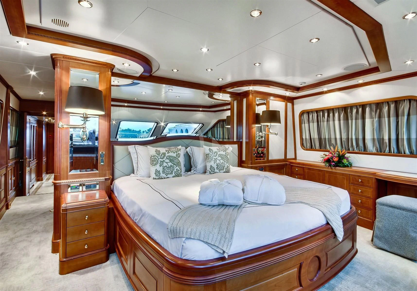 a bedroom with a bed and a desk aboard KEIKI KAI Yacht for Sale