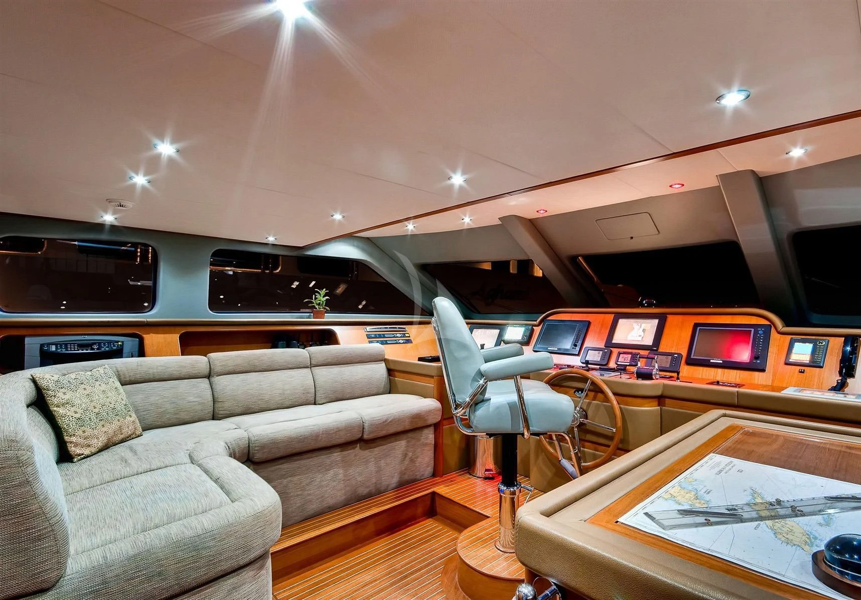 a living room with a couch and a television aboard KEIKI KAI Yacht for Sale