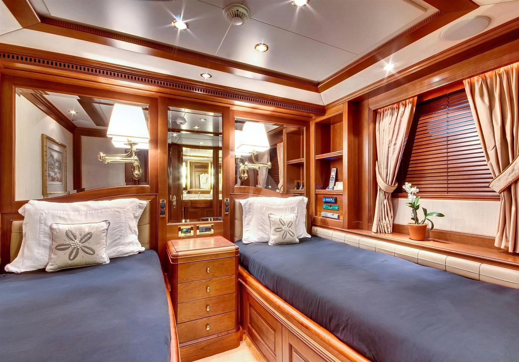 a room with a bed and a dresser aboard KEIKI KAI Yacht for Sale