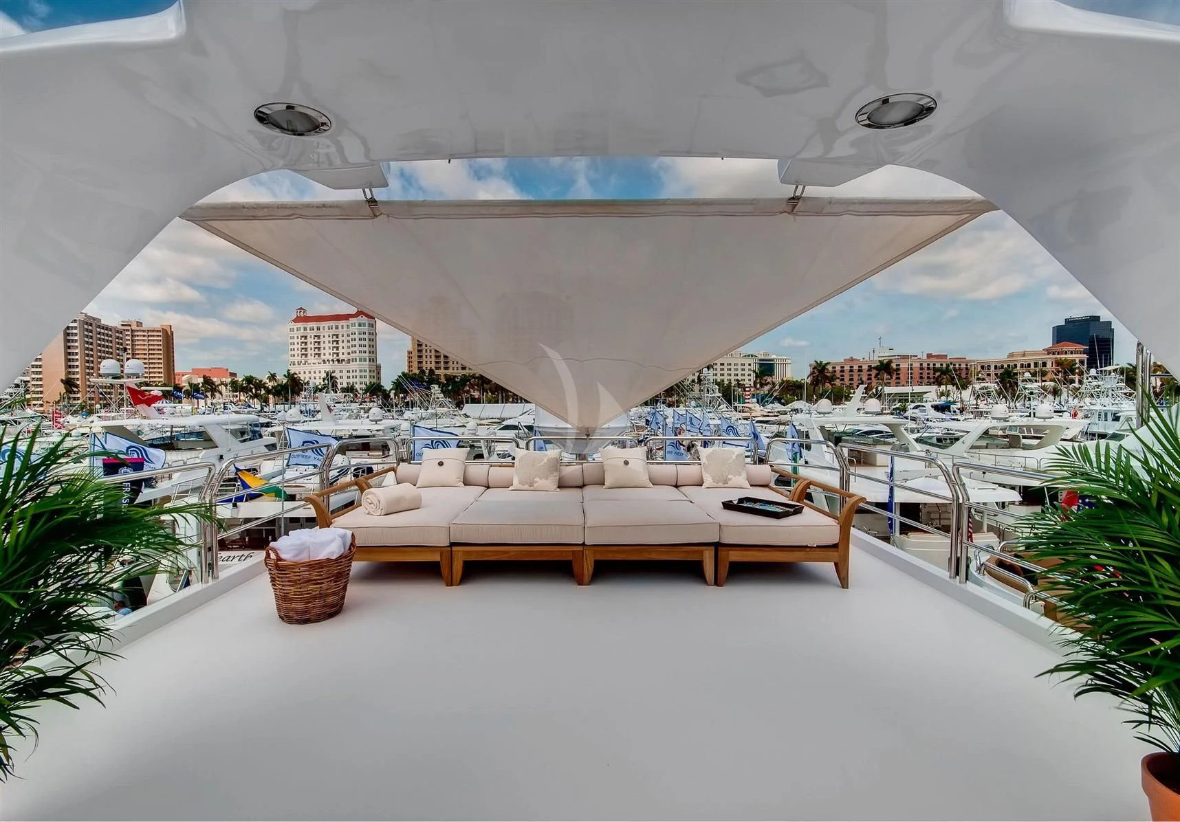 a large building with a large white tent and a beach with chairs and a table and a large aboard KEIKI KAI Yacht for Sale