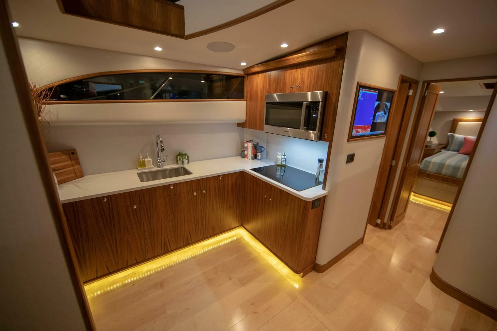 a kitchen with a sink and a microwave aboard PRIVATEER Yacht for Sale