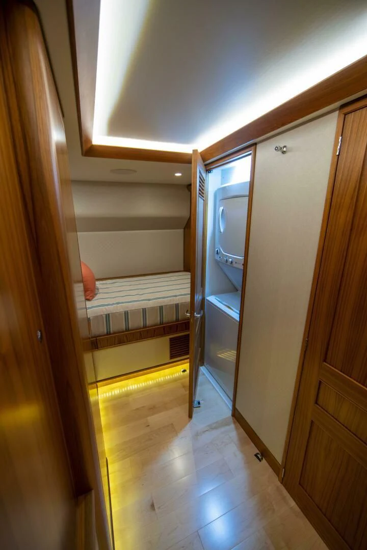a bathroom with a wood door aboard PRIVATEER Yacht for Sale