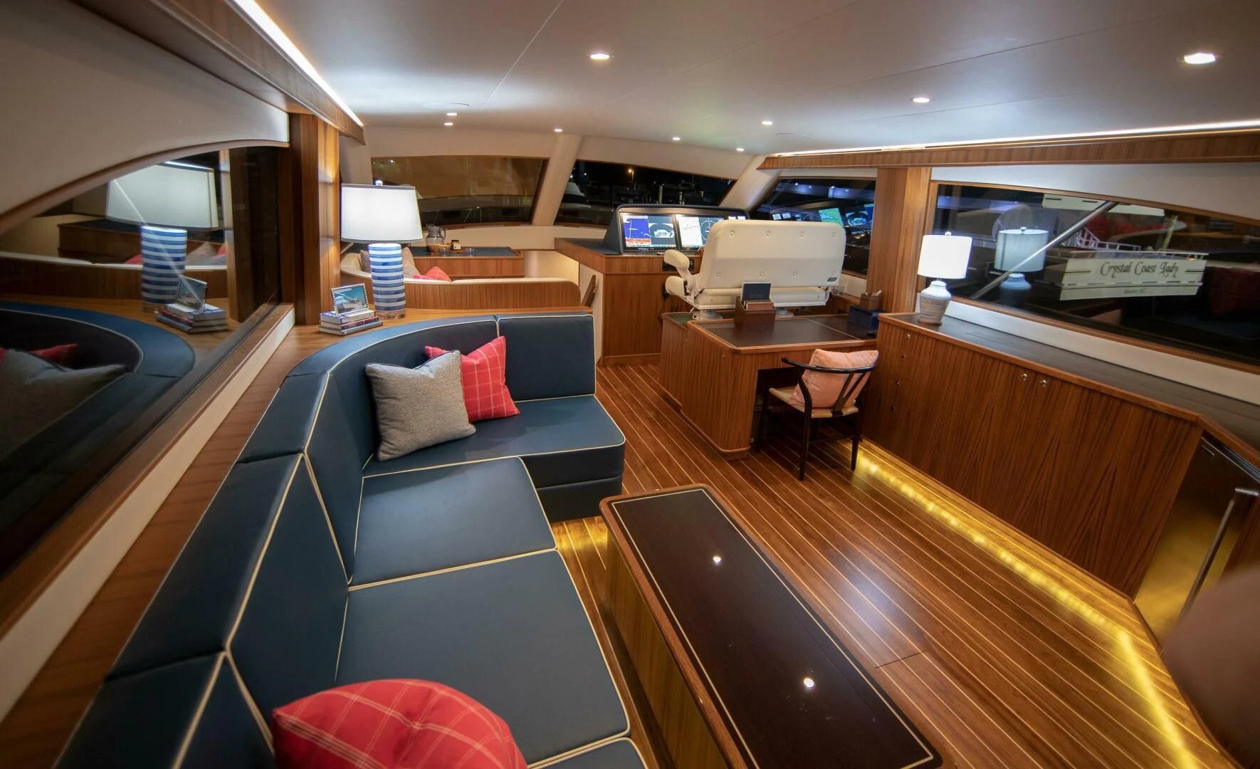 a room with a couch and a table aboard PRIVATEER Yacht for Sale