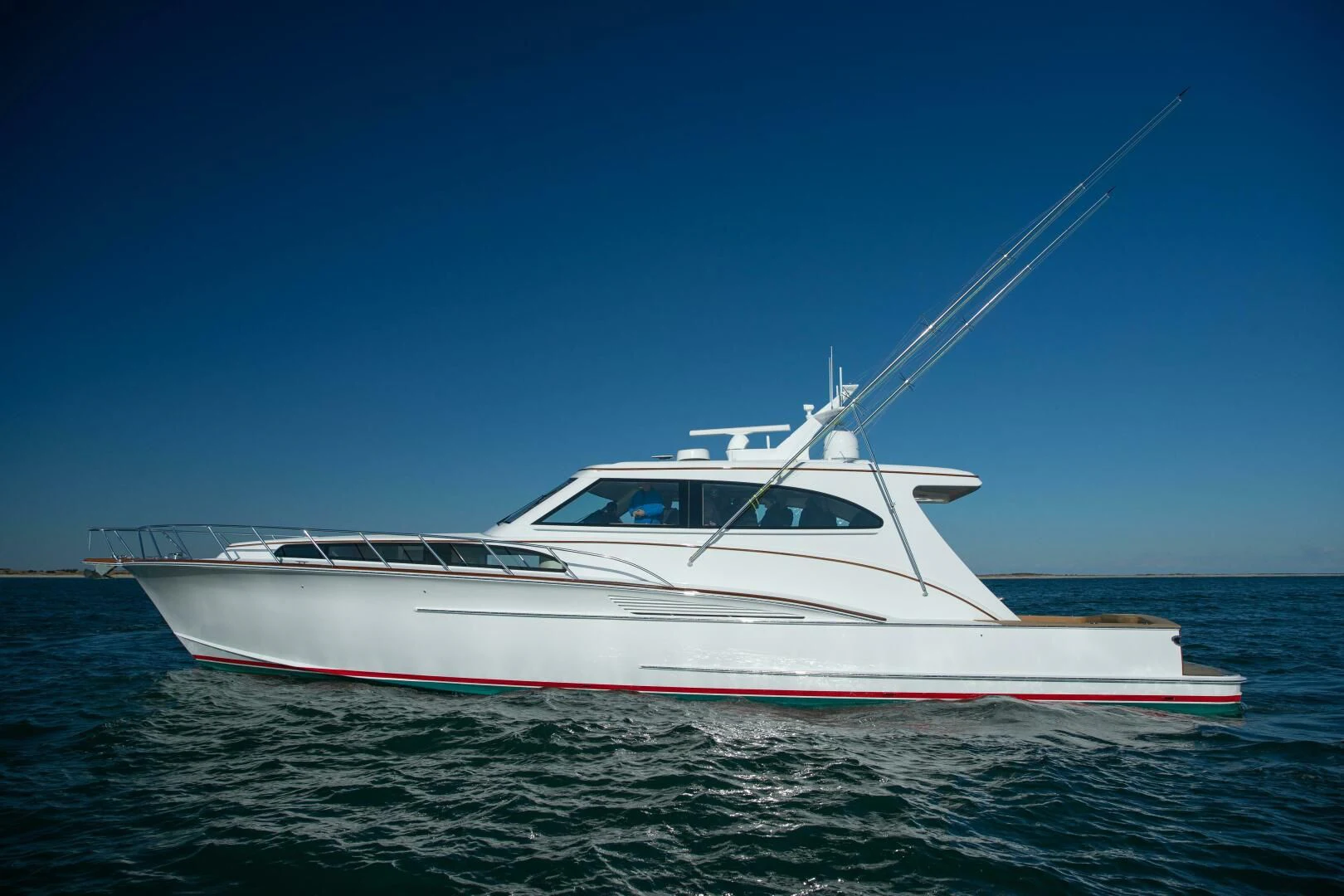 a white boat on the water aboard PRIVATEER Yacht for Sale