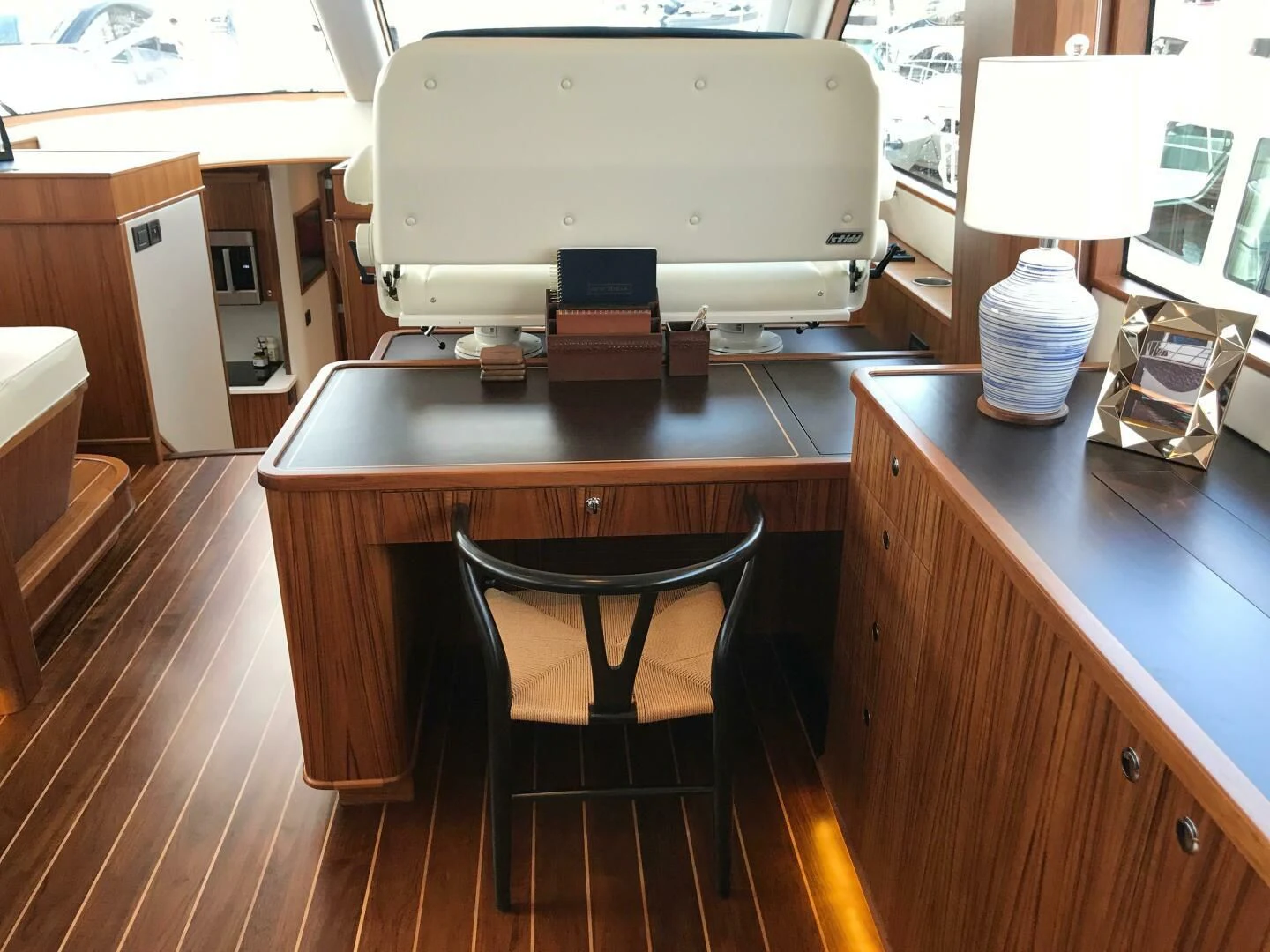 a kitchen with a large white refrigerator aboard PRIVATEER Yacht for Sale