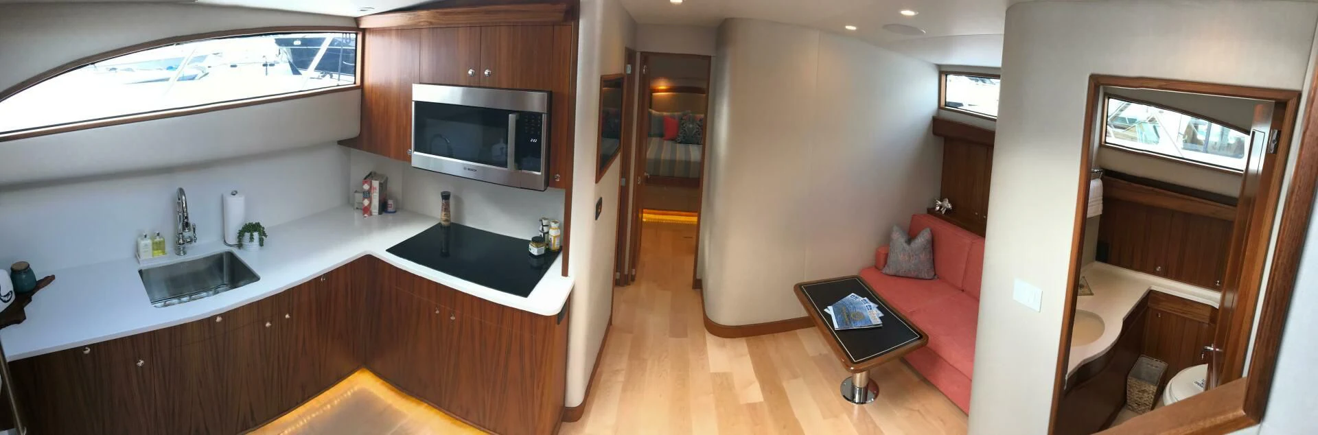 a kitchen with a sink and a microwave aboard PRIVATEER Yacht for Sale