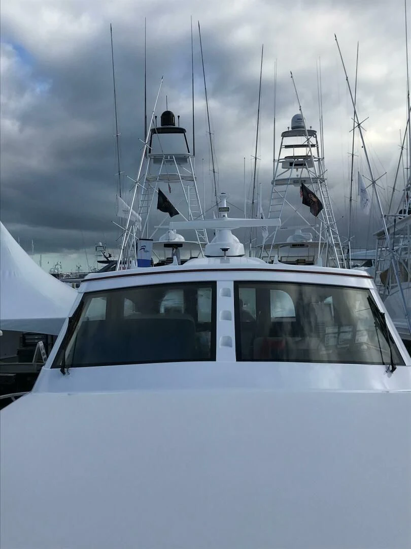 a white boat with a white sail aboard PRIVATEER Yacht for Sale