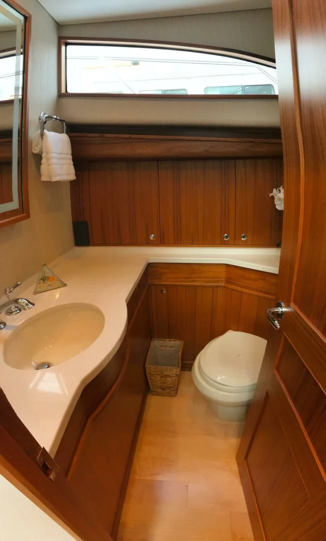 a bathroom with a sink and toilet aboard PRIVATEER Yacht for Sale
