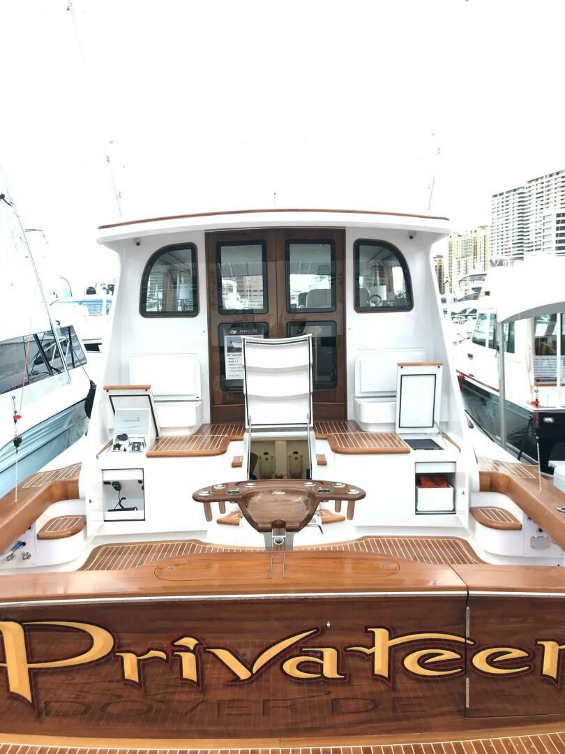 a display of a white vehicle aboard PRIVATEER Yacht for Sale