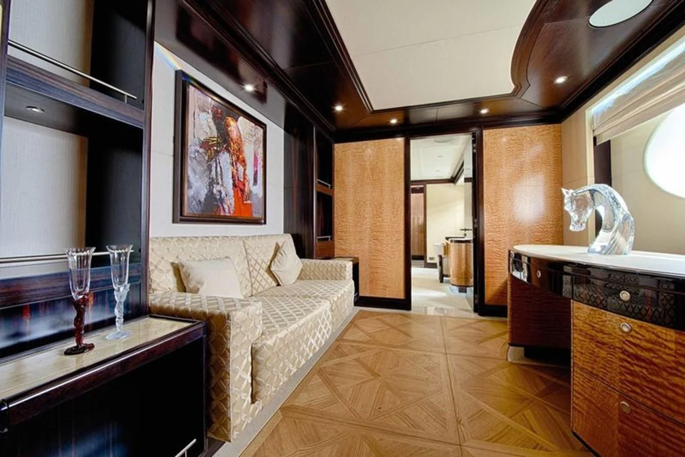 a room with a bed and a table aboard OCTOBER Yacht for Sale