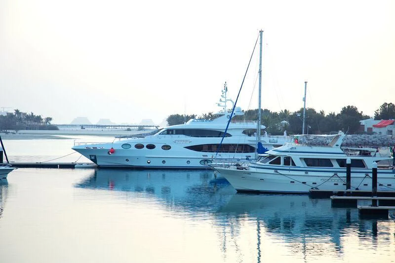 a group of boats are parked in a harbor aboard OCTOBER Yacht for Sale