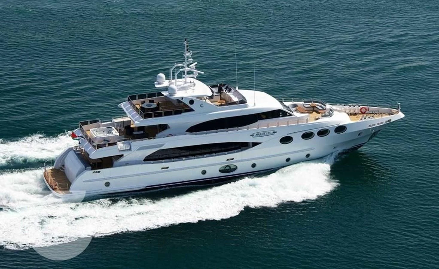 a white boat in the water aboard OCTOBER Yacht for Sale