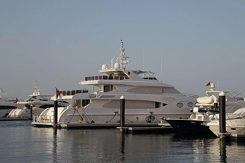 a large white ship docked aboard OCTOBER Yacht for Sale