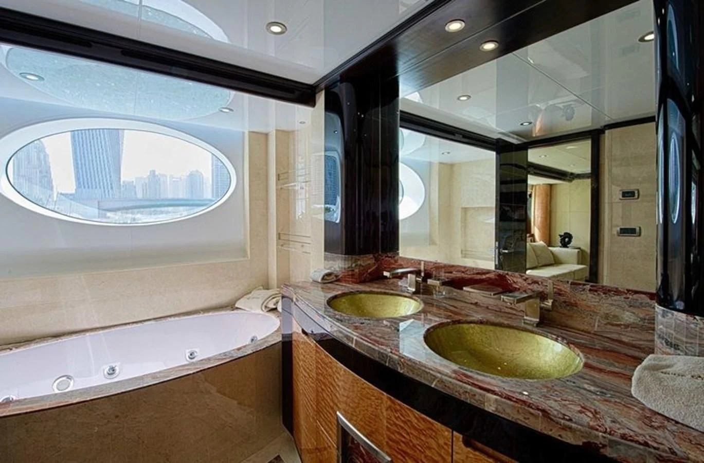 a bathroom with a sink and a large mirror aboard OCTOBER Yacht for Sale